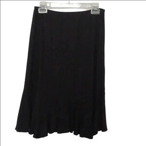 - Black, very soft fabric skirt with a ruffles